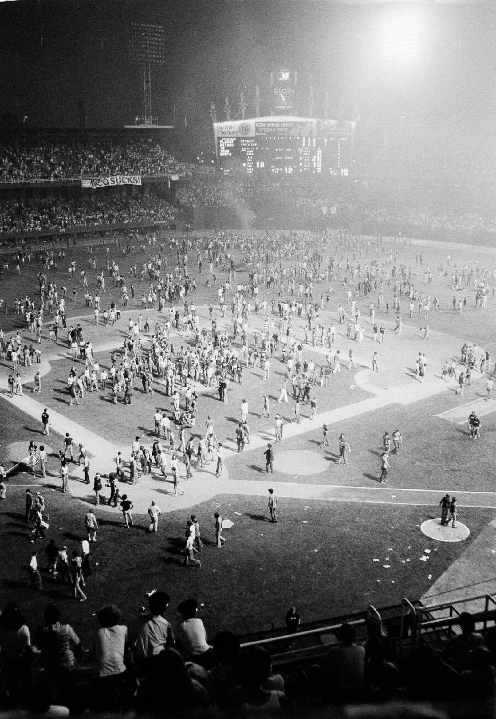 Thousands of fans storm the field at Comiskey Park during the disco record-burning stunt, July 12, 1979, forcing the second game to be forfeited.